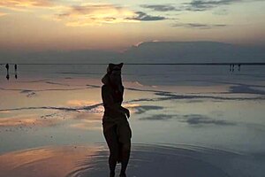 Pink sky and white salt under a stunning view.