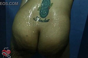 latina milf masturbates bent over in shower