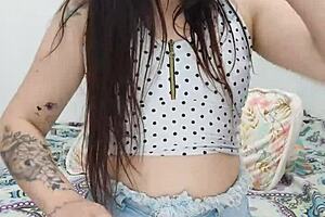 Naughty brunette teases with lollipop deep in wet pussy