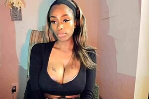 Tattooed milf with big tits teases her pussy in a steamy solo session