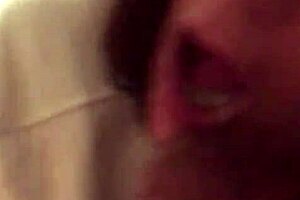 mature white woman casually sucking small black cock in everyday scene