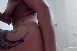 Colombian milf fingers herself in the shower