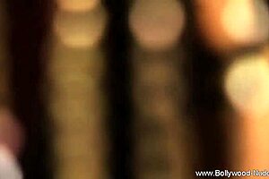 The erotic brunette milf dancer teases with striptease.