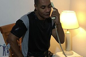 African American milf with bouncing boobs in short action scene.