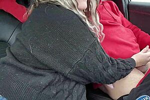 A hot milf gives her husband a blow job in their car
