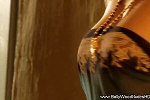 Bollywood Indian MILF dancing nude to music, ripping clothes in glamorous striptease