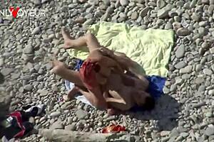 Tanned MILF gets a passionate beach encounter with a stud
