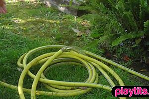 the big ass curvy swiss milf model strips in the garden, undressing slowly and ripping clothes to show her curves