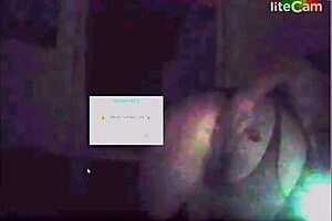 A milf with big tits showcases her assets in a steamy scene