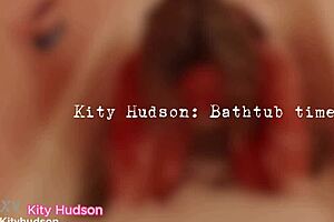 kity hudson is in the bath tub, showing off her curvy body.