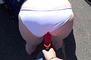 So, this girlfriend strapped on and banged a curvy milf by the car. Wild outdoor lesbian action!