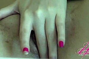 Lauren Phillips, the redhead adult film star, has a hot scene where she has to pleasure herself on the bed