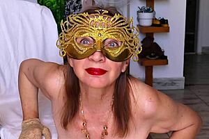 i'm this mystical granny revealing secrets behind my golden mask while masturbating my big hairy tits close up.