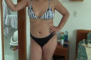 Stepmother on Beach in Bikini, Showing Off for a Lucky Guy. Who Wants to Join Her?