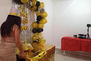 Beautiful lady hosts party in elegant dress