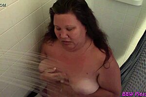 Naughty BBW housewife strips naked for steamy bath fun 😜