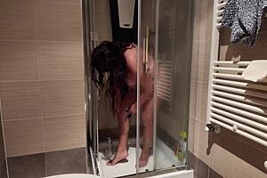 I’m obsessed watching this big-breasted milf shave her hairy pussy in the shower