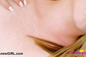 A radiant blonde beauty poses naked in a close-up photoshoot