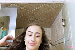 Stunning brunette model takes a shower