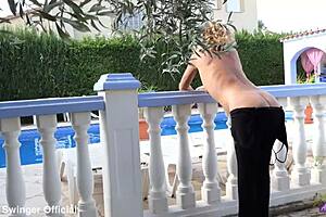 Mature housewife dances in black heels in the garden