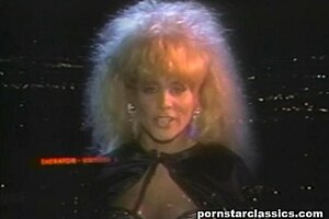 the night temptress licks and plays with big tits