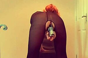 Stunning British milf Lilithalgol in bodystocking and heels plays with insertion for a standing climax.