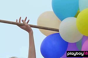 skinny italian milf blondie playing with balloons on the beach, so fun