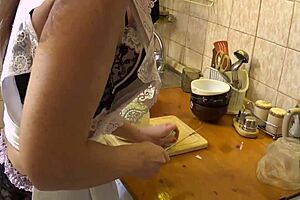 The mature amateur carefully prepares the carrots for cooking.
