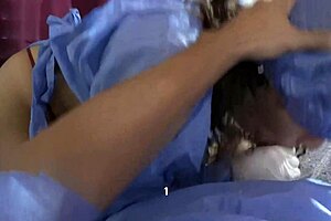 Nurse takes semen sample with her mouth in hospital.