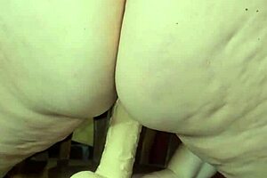 redhead milf rides dildo and squirts all over the toys