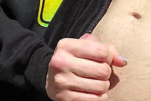 Husband fingers wife's shaved pussy outdoors with reach around.