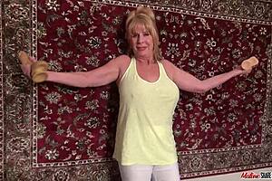 Blonde mature granny masturbates by driving massive dildo into her pink cherry pussy