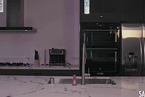 In the kitchen, milf sara jay plays with her pink glass dildo and big tit's