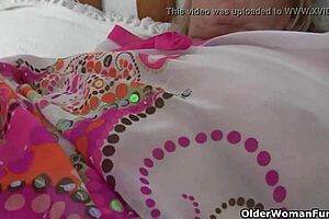 Granny with big tits gets fingered by photographer