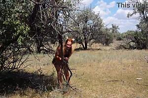 Shy aboriginal woman in costumes dancing outdoors at milf cosplay event