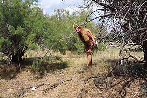Shy aboriginal woman in costumes dancing outdoors at milf cosplay event