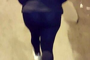 Look at this mature street whore flashing her thong in transparent leggings outdoors.