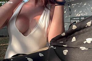 Artemisia love is showing off her big horny tits outdoors.