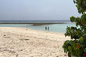 Stepmom and stepdaughter picked up on beach for risky public handjob, ending with cum on face.