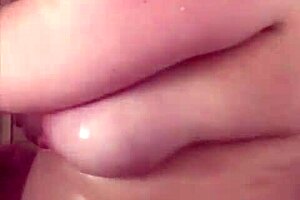 Big boob mama powerfully showers, washes hair, and shaves.