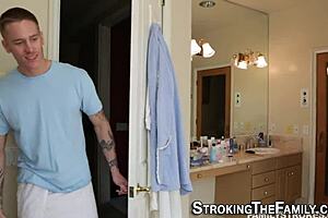 I watch the teen give a handjob to her stepbrother's cock.