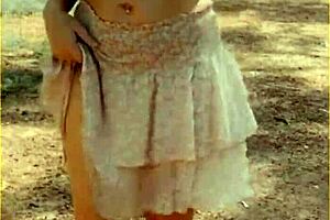 Wifey changes her shirt in the outdoors. She exposes shaved pussy and tits fully.