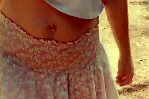 Wifey changes her shirt in the outdoors. She exposes shaved pussy and tits fully.