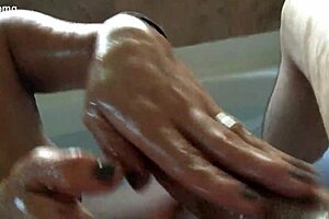 mom gives amazing handjob to a big cock in bathtub