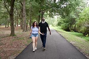 Nerdy milf strokes and sucks big black dick in the park