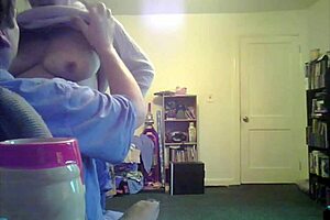 Loris shows titties in the living room setting.