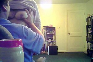 Loris shows titties in the living room setting.