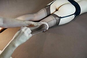 Horny MILF in stockings gets soles massaged until moaning with tickling fetish play. Feet worship builds to intense nylon-covered orgasm.