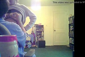 Loris shows titties in the living room setting.