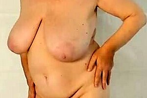 Hot granny strips huge natural tits with closeup